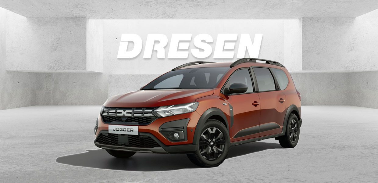 Roter Dacia Jogger vor Betonwand mit großem ‚DRESEN‘-Schriftzug darüber.