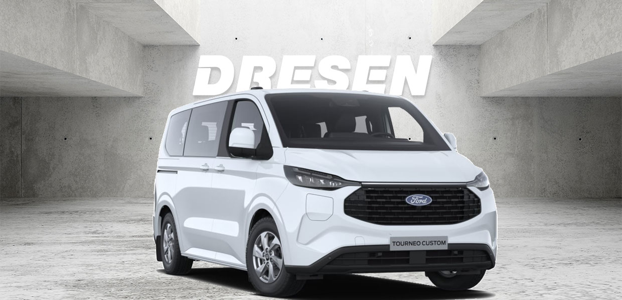 Weißer Ford Torneo Custom vor Betonwand mit großem ‚DRESEN‘-Schriftzug darüber.