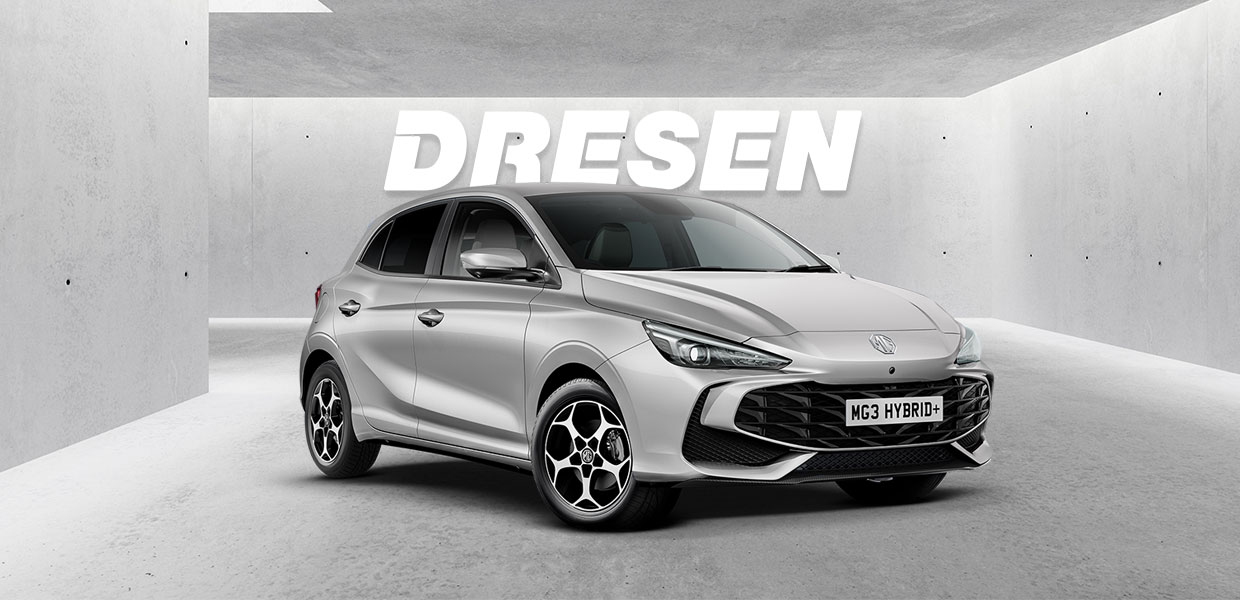 Silberner MG3 Hybrid+ vor Betonwand mit großem ‚DRESEN‘-Schriftzug darüber.