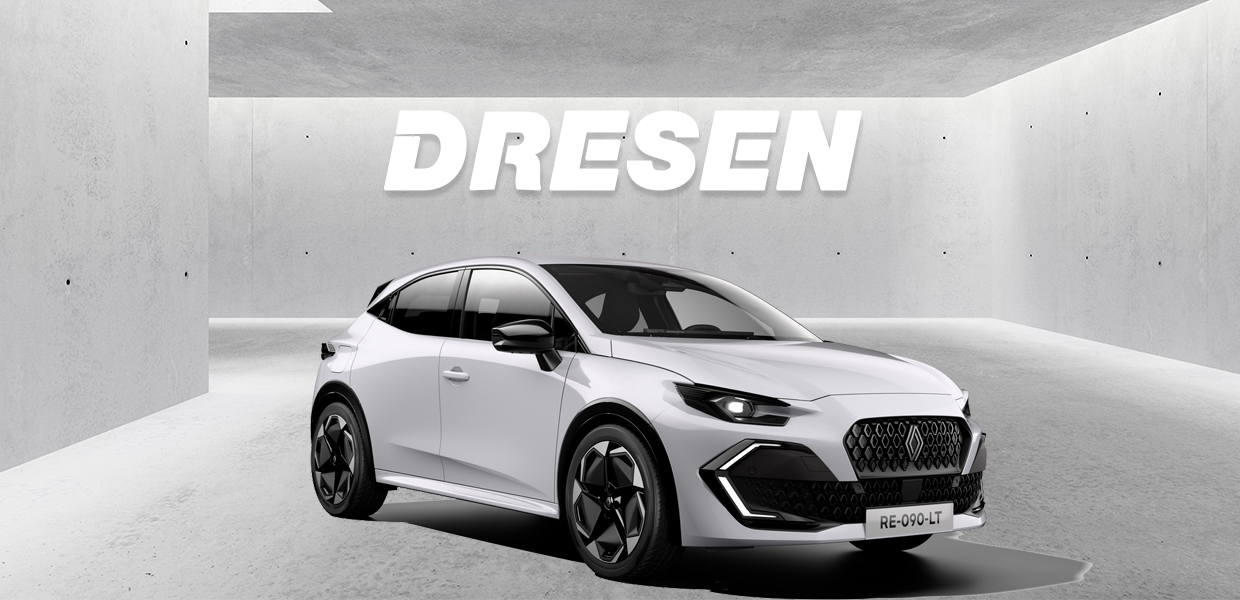 Weißer Clio vor Betonwand mit Dresen Logo