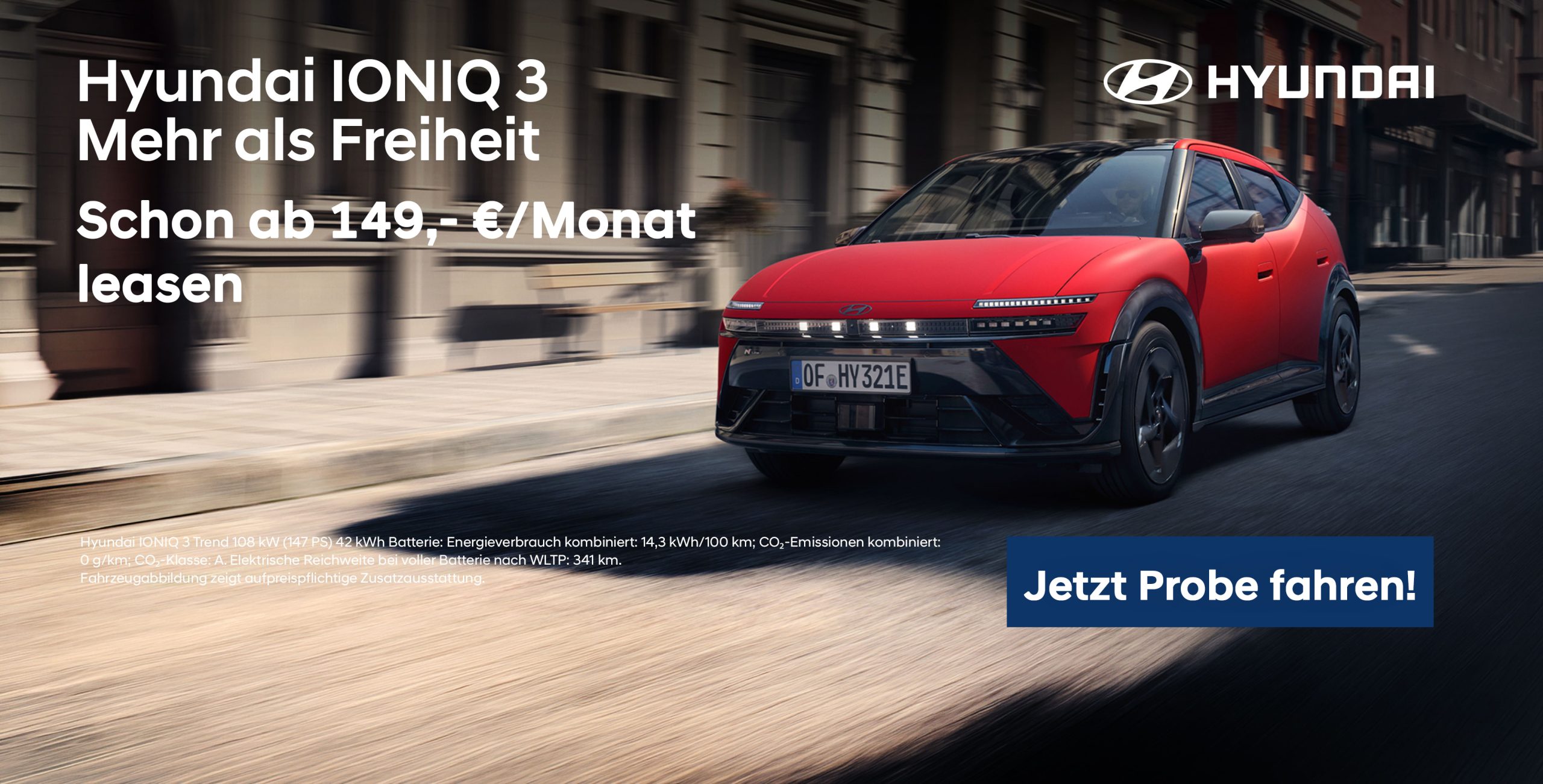 IONIQ 3 Rot vor Häusern